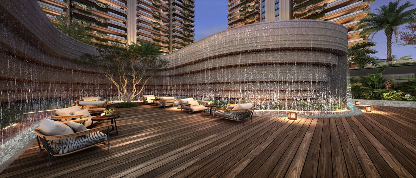 Luxury waterfall lounge and outdoor seating area at Clove County Sector 151 Noida