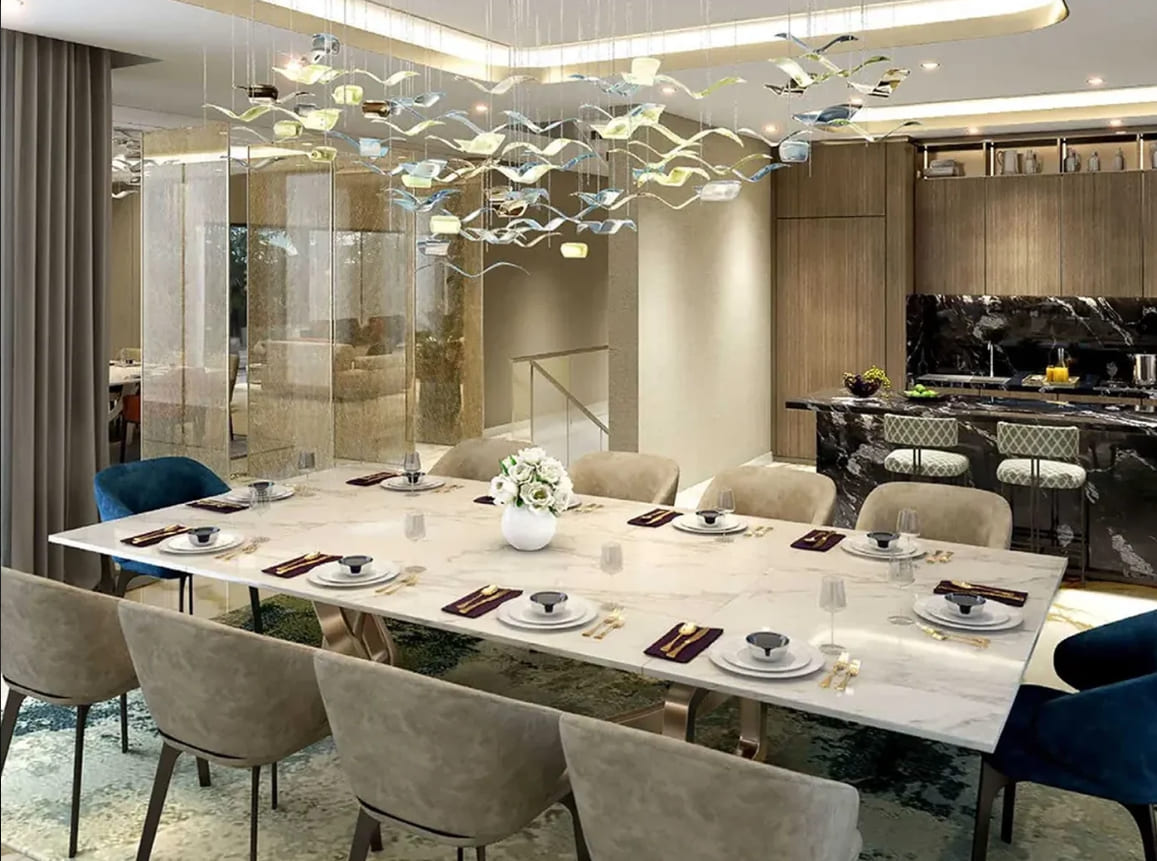 Elegant dining area with contemporary kitchen and luxury interiors at Godrej Arden