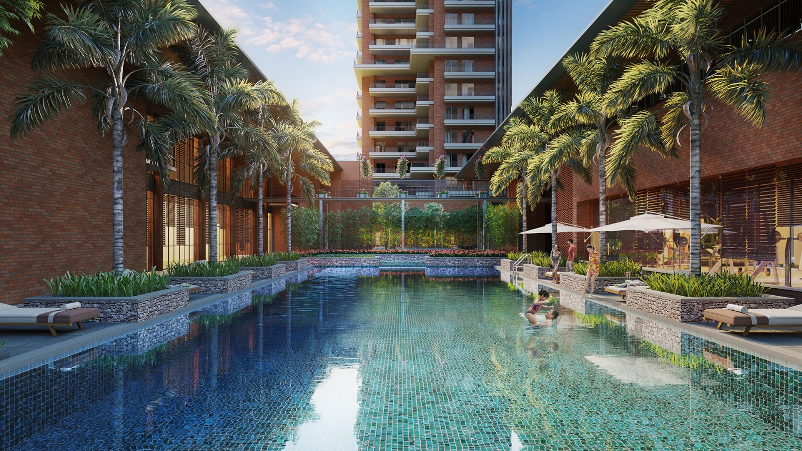 Luxurious courtyard swimming pool area bordered by brick buildings, tropical palm trees, and elegant lounge chairs